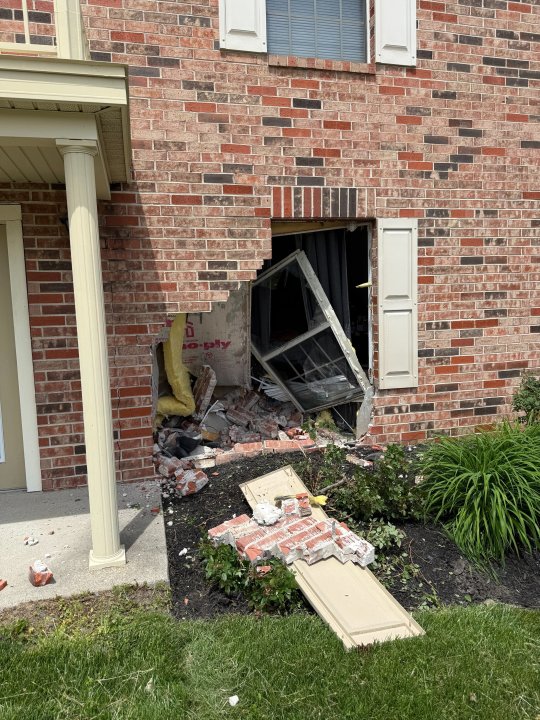 IFD: Woman ‘seriously’ injured after vehicle crashes into apartment on Indy’s west side