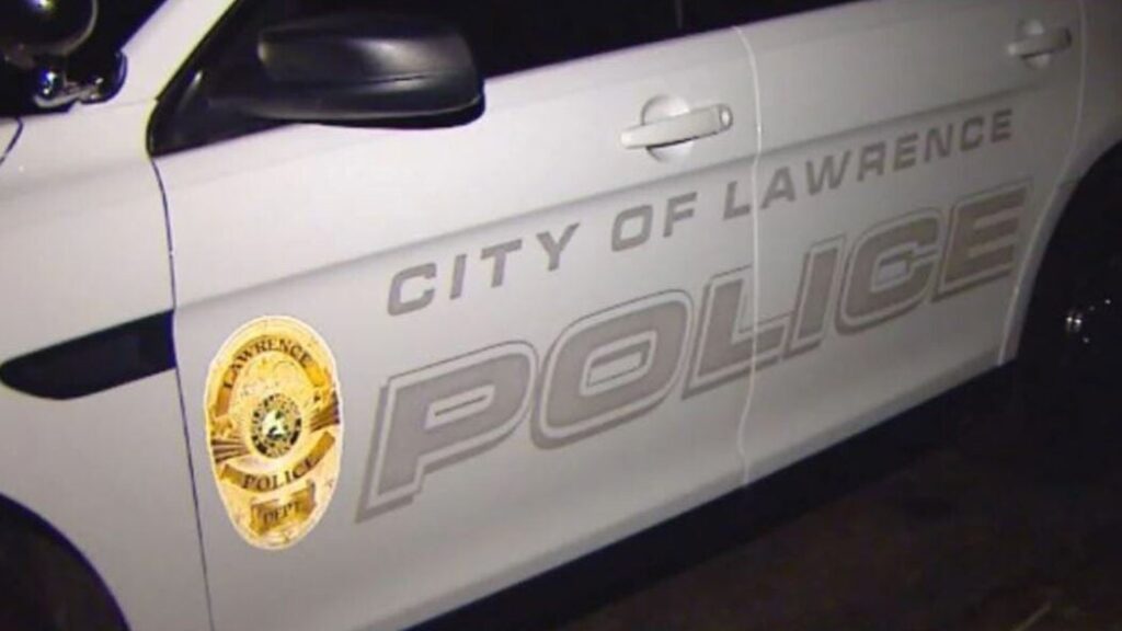 Motorist strikes Lawrence Police Department vehicle; officer hospitalized