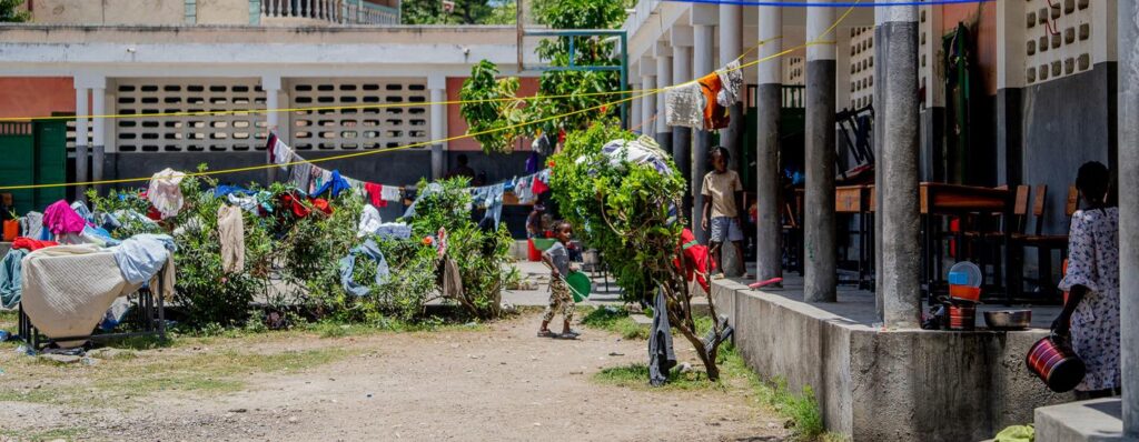 Desks become beds as Haitian school shelters people displaced by violence
